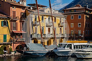 Lake - lago - Garda, Italy. Town of Malcesine, lakeside resort. Old harbour photo