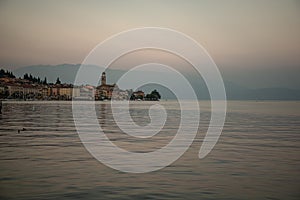 Lake - lago - Garda, Italy. Town of SalÃ², lakeside promenade at sunset