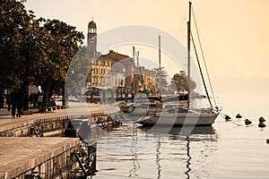 Lake - lago - Garda, Italy. Town of  SalÃ², lakeside promenade at sunset