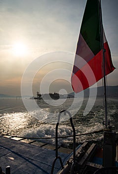Lake - Lago Maggiore, Italy. Isola dei Pescatori seen from a ferry boat at sunrise