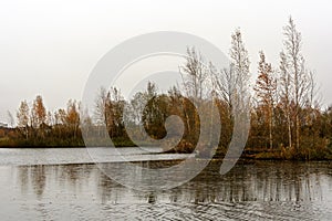 The lake in late autumn and the first dark ice