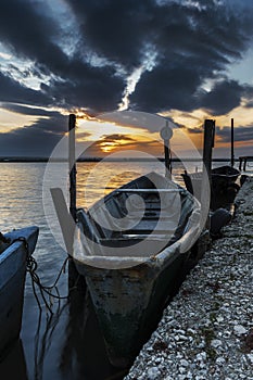 Lake Lesina and its sunset and boats photo