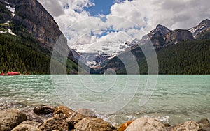 Lake Louise in Banff National Park, Alberta, Canada. Lake Louise panorama of snow-capped mountain peaks, coniferous forest