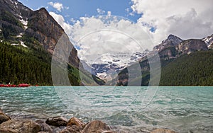 Lake Louise in Banff National Park, Alberta, Canada. Lake Louise panorama of snow-capped mountain peaks, coniferous forest