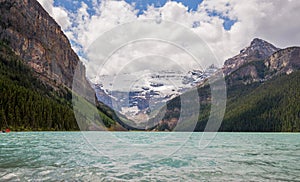 Lake Louise in Banff National Park, Alberta, Canada. Lake Louise panorama of snow-capped mountain peaks, coniferous forest