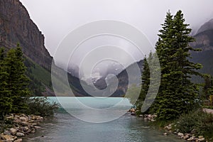 Lake Louise, Banff National Park, Alberta, Canada tourism. Snow covered Rocky Mountain lake landscape panorama without peopl