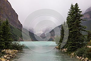 Lake Louise, Banff National Park, Alberta, Canada tourism. Snow covered Rocky Mountain lake landscape panorama without peopl