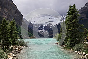 Lake Louise, Banff National Park, Alberta, Canada tourism. Snow covered Rocky Mountain lake landscape panorama without peopl