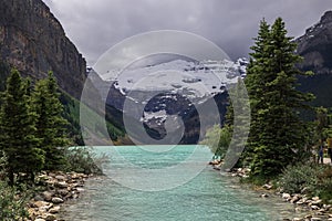 Lake Louise, Banff National Park, Alberta, Canada tourism. Snow covered Rocky Mountain lake landscape panorama without peopl