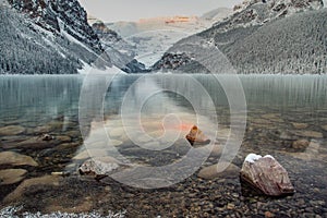 Lake Louise British Columbia at sunrise during the winter with fresh snow