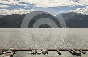 Lake Lugano, mountains and clouds - boats.