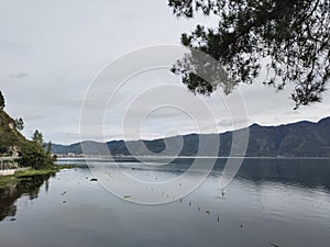 Lake Lut Tawar surrounded by mountains and hills in the Gayo highlands, Central Aceh, Aceh, Indonesia