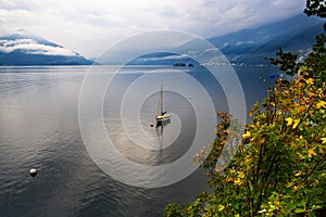 Lake Maggiore with boat, Alps hill, Ascona