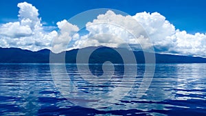 Lake matano horizon with thick clouds photo