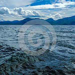 Lake Matano with tidal waves and clear sky photo
