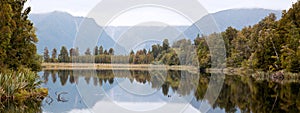 Lake Matheson with cloudy sky New Zealand