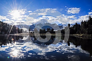 Lake Matheson Reflection in the Morning with Sun Flare