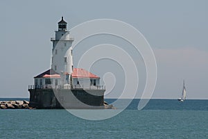 Lake Michigan lighthouse and sailboat off Navy Pier Chicago