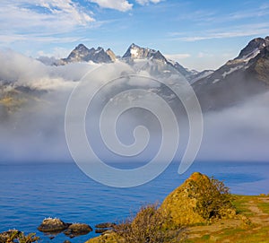 lake in a misty mountain valley