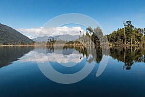 Lake Moana (Brunner) with the Hohonu mountain range in distance on West Coast, New Zealand