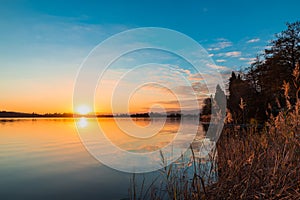 Lake Monate seen from Travedona Monate at sunset; view towards Cadrezzate; province of Varese, Italy photo