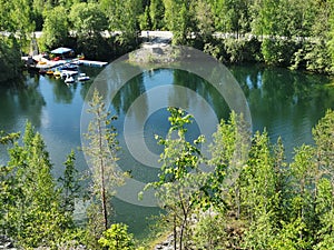 Lake Montferrand with turquoise water and catamarans in the Ruskeala Mountain Park on a sunny summer day