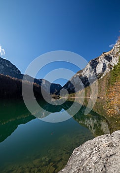 Lake and mountain with reflection during autumn in austria