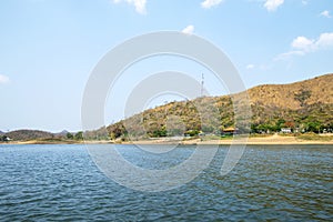 Lake and mountain scenery with beautiful blue sky and white clouds at Kaeng Krachan Dam in Thailand