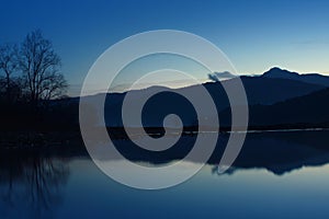 Lake and mountain at twilight or blue hour.