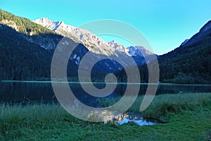 Lake in the mountains, beauty of nature, alpine landscape, mountains, blue sky, snow covered mountain peaks