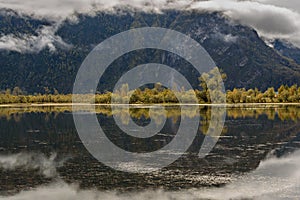 Lake mountains clouds fog reflection