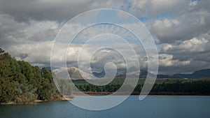 Lake and mountains with cloudy blue sky - Lago y montaÃÂ±as con cielo azul nublado photo