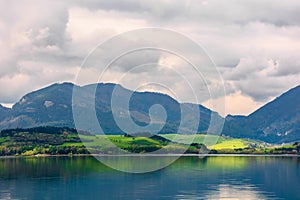 Lake in mountains. cloudy day in springtime.