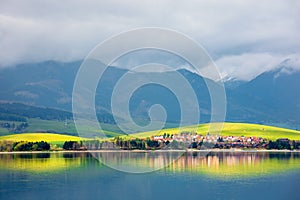 Lake in mountains. cloudy day in springtime.