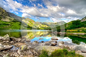 Lake in mountains in the early morning colors.