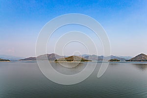 Lake and mountains landscape on rainless day