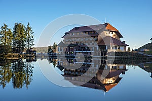 The lake Mummelsee and the mountain hotel in Seebach