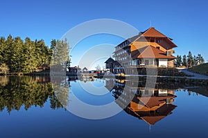 The lake Mummelsee and the mountain hotel in Seebach