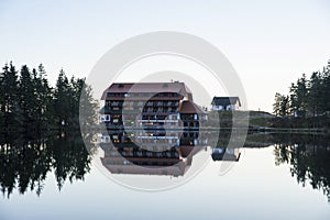 The lake Mummelsee and the mountain hotel in Seebach