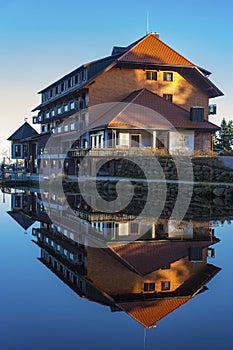 The lake Mummelsee and the mountain hotel in Seebach