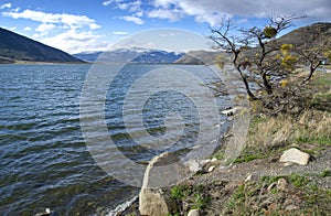 Lake near Puerto Natales, Chile with snow mountains in the background