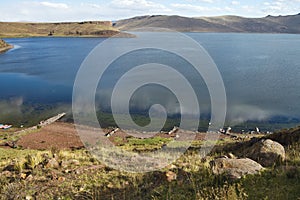 Lake near Silustani tombs in the peruvian Andes at Puno Peru