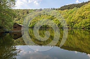 Lake Nisramont in the river Ourthe in the Ardennes, Belgium photo