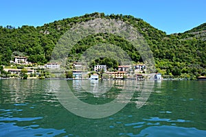 Lake panorama from ferry with island Monte Isola. Italian landscape. Island on lake. Lake Iseo, Italy