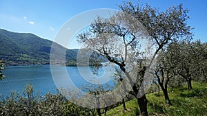 Lake panorama from `Monte Isola` with clouds. Italian landscape. Island on lake. View from the island Monte Isola on Lake Iseo, It