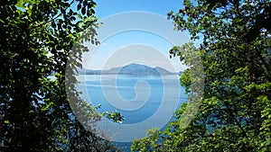 Lake panorama from `Monte Isola`. Italian landscape. Island on lake. View from the island Monte Isola on Lake Iseo, Italy