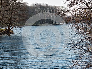 Lake with a path along the shore in winter