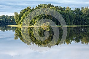 A lake, perfect reflection, clouds, and forest