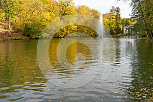 Lake picturesque landscape,Autumn view with fountain and yellow trees, Uman, Sofievka park