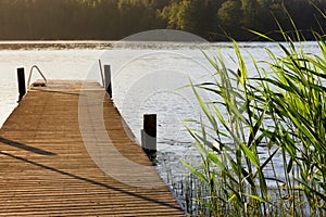 Lake and pier at summer morning